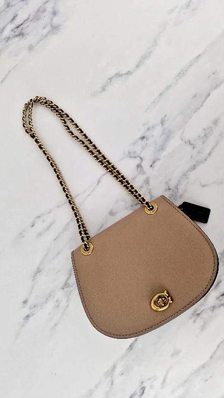 Edgy Bags For Bold And Daring Fashionistas Coach Parker Saddle Bag Double Sided Tea Rose Turnlock C Turnlock Black & Taupe Crossbody Bag - Coach 67114